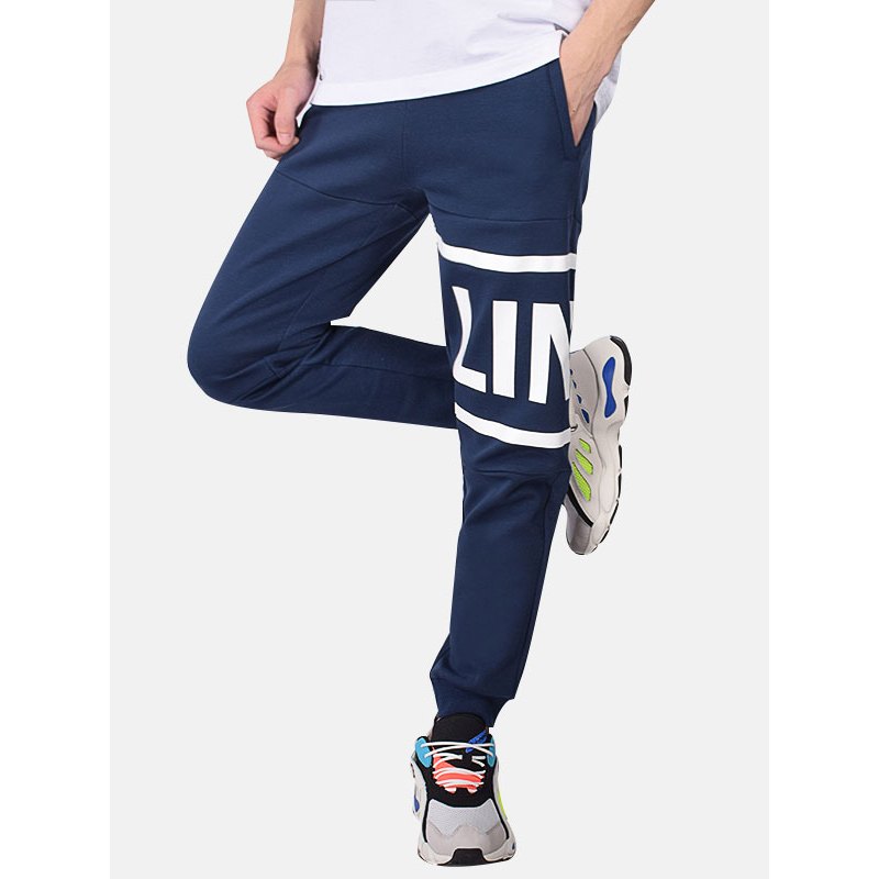 李宁(LI-NING)运动裤男裤春季时尚印花字母显瘦收口卫裤子AKLP307 深蓝色 4XL/195